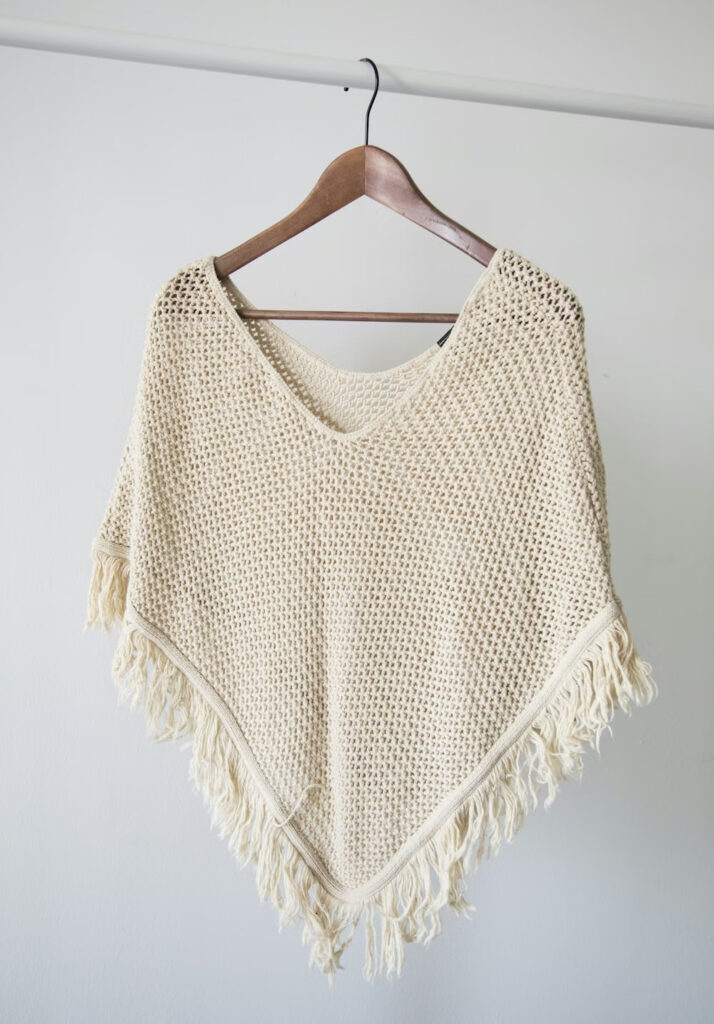 Close up texture of a soft beige cashmere knitwear.